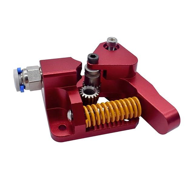 Extrudeur en aluminium rouge avec ses pignons, un ressort de tension jaune et un raccord instantané